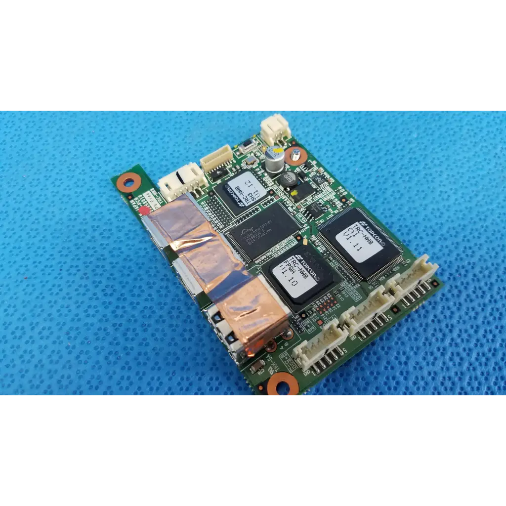 Green circuit board logic motherboard board with black integrated circuits and copper heat sinks for fundus retinal camera