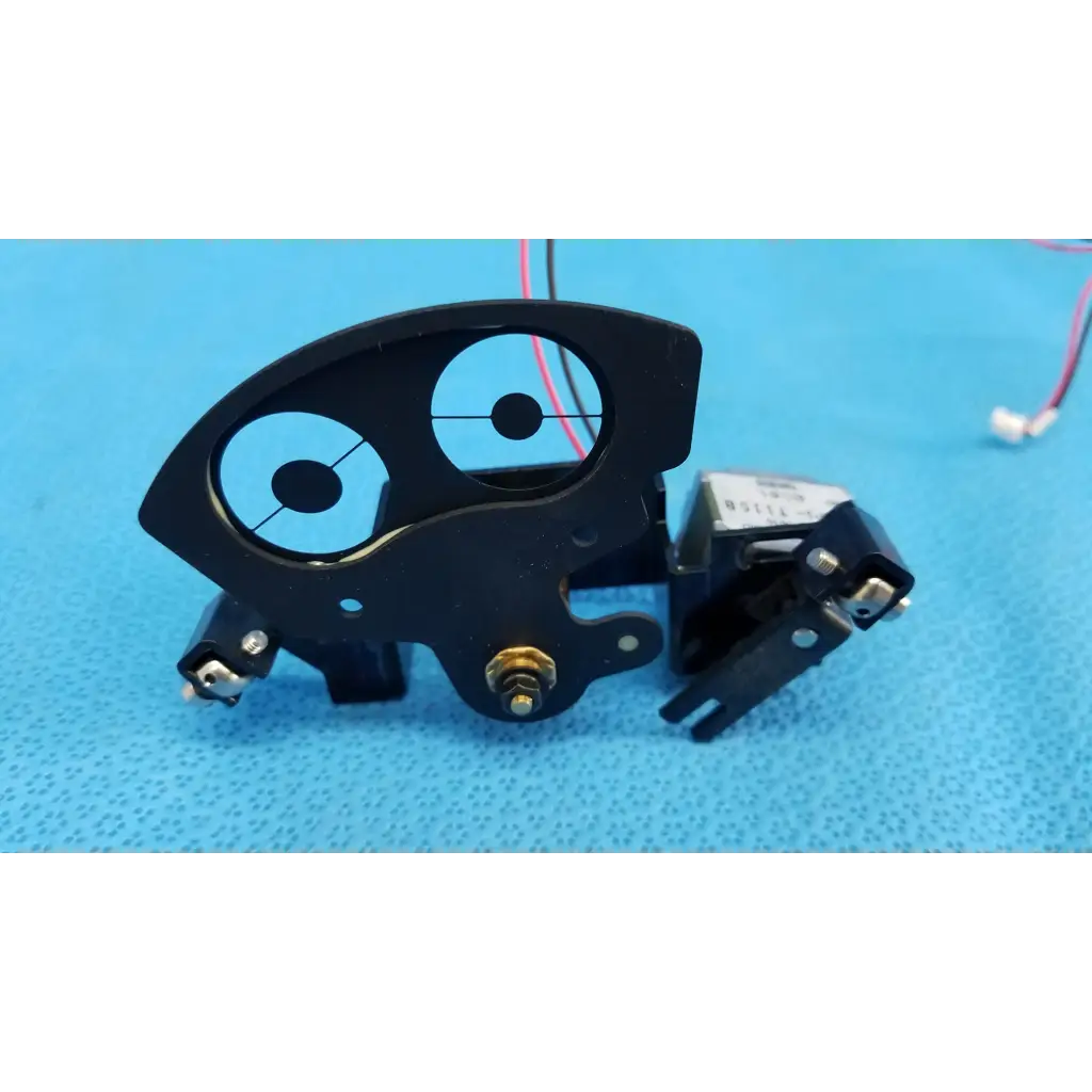 Black plastic internal takano rotary solenoid aperture diaphragm with metallic connectors and gold screw for topcon camera