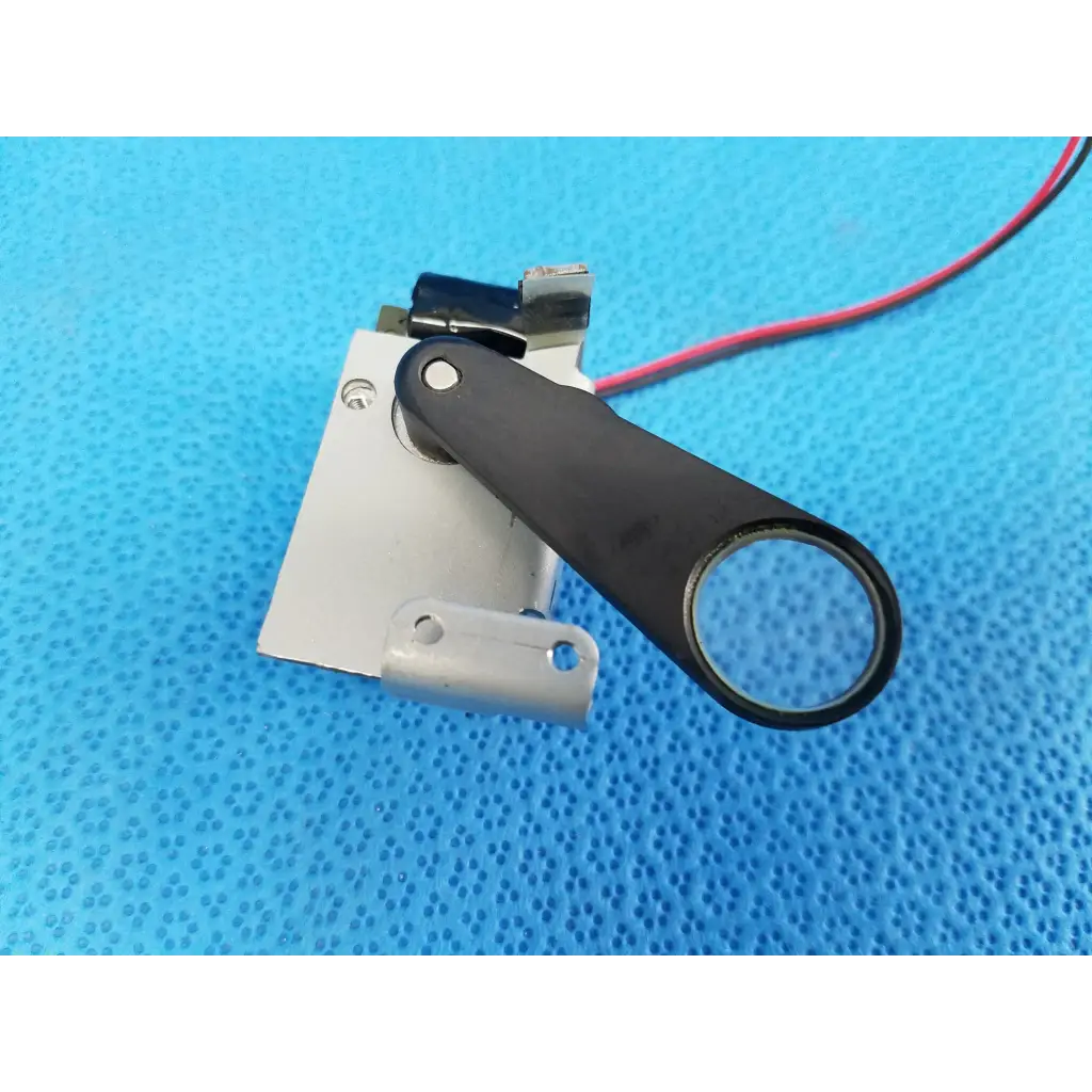 Black-handled rotary solenoid filter shutter with circular lens and red wire for topcon trc-nw8 fundus camera