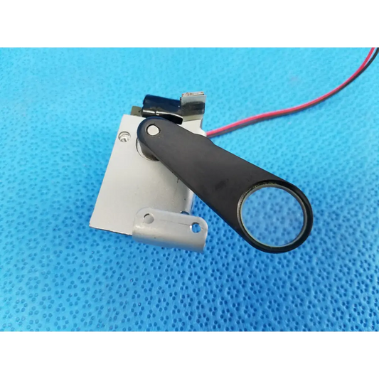 Black-handled rotary solenoid filter shutter with circular lens and red wire for topcon trc-nw8 fundus camera