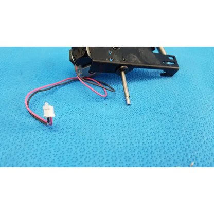 Black plastic and metal rotary solenoid mechanical switch with pink and black wires for topcon fundus camera