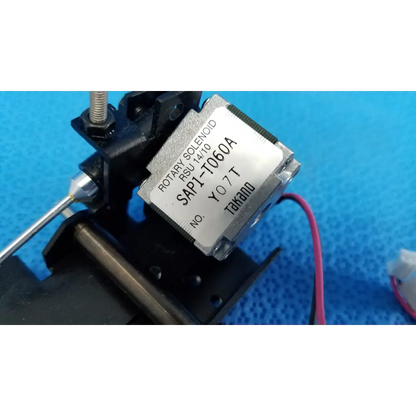 Silver-colored rotary solenoid mechanical switch with black housing and red wire sap1-t060a by takano for topcon camera