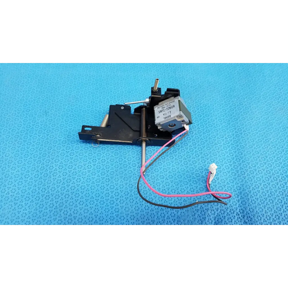 Black plastic and metal rotary solenoid mechanical switch with pink and black wires labeled sap1-t3r0a for topcon retinal camera