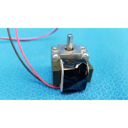Silver metal rotary solenoid with black wrapped component and pink gray wires for topcon fundus retinal camera