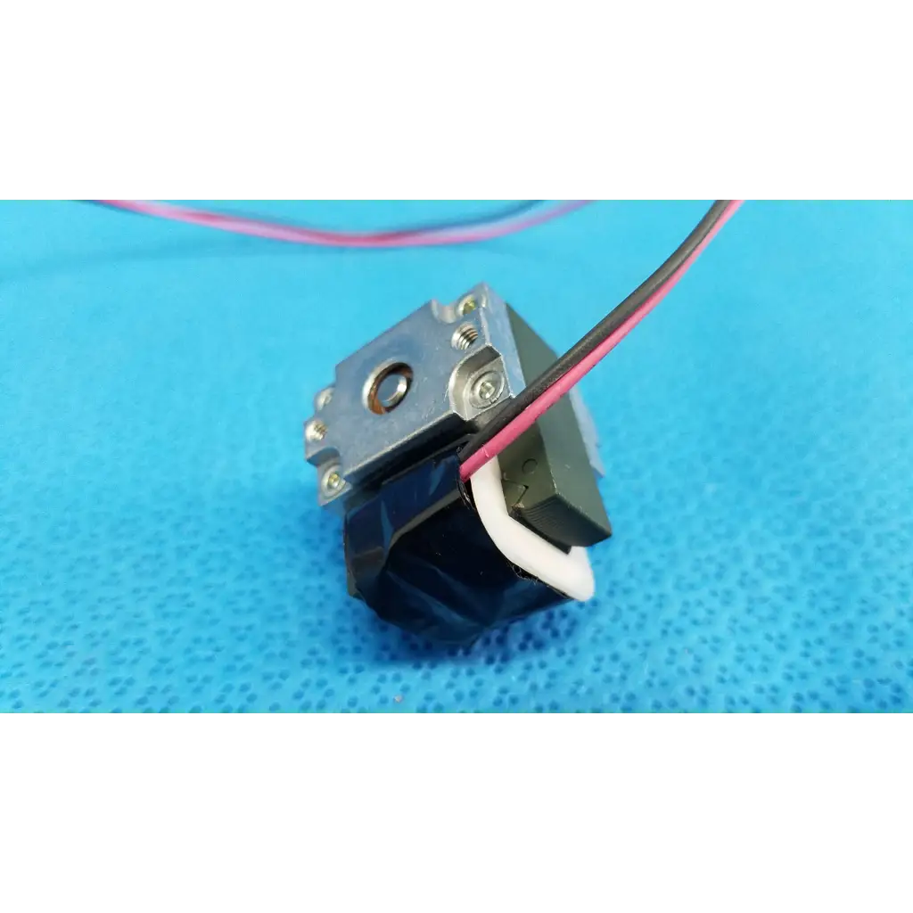Black and silver internal Takano rotary solenoid with exposed wiring for Topcon TRC-NW8 fundus retinal camera