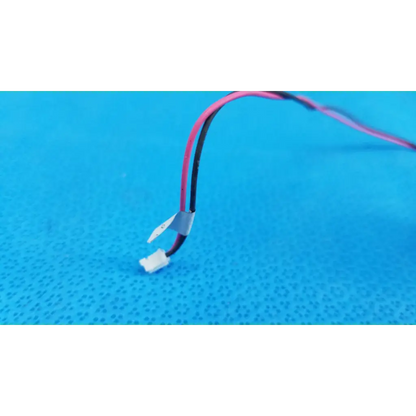 A pair of pink and black insulated wires with white connector and gray tape for internal rotary solenoid in fundus retinal camera