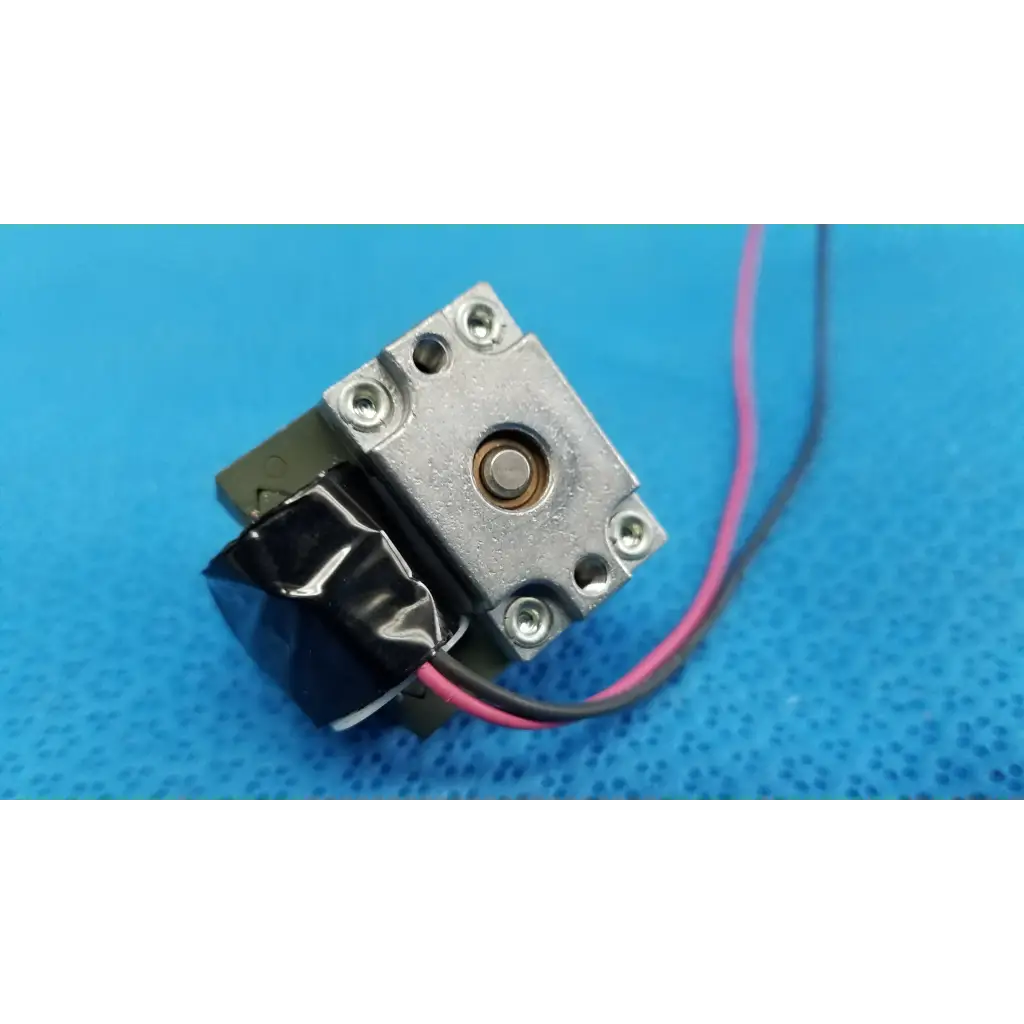 Silver-colored internal takano rotary solenoid valve with black cover and pink black wires for topcon fundus retinal camera