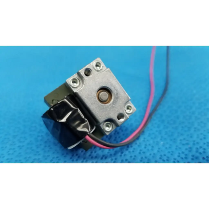 Silver-colored internal takano rotary solenoid valve with black cover and pink black wires for topcon fundus retinal camera