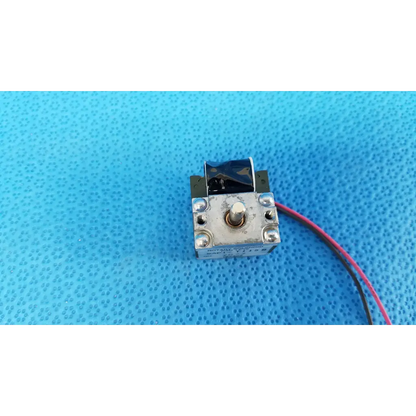 Small silver metallic rotary solenoid valve with black cover and red wire for topcon fundus retinal camera use