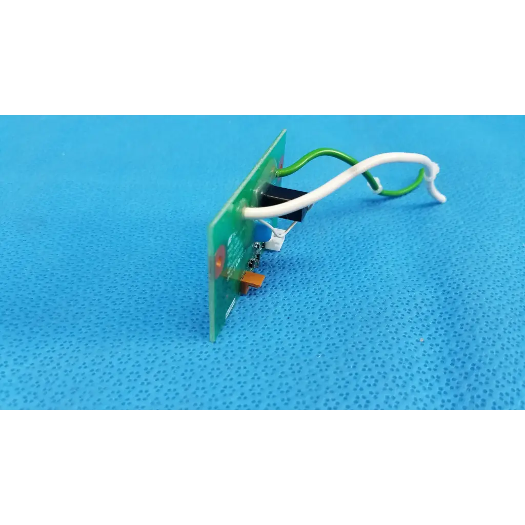 Green circuit board with white and green wires connected to black component xenon flash trigger pcb for Topcon camera