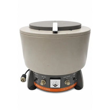 Gray laboratory centrifuge with black lid and orange control panel biomed certified by international equipment company