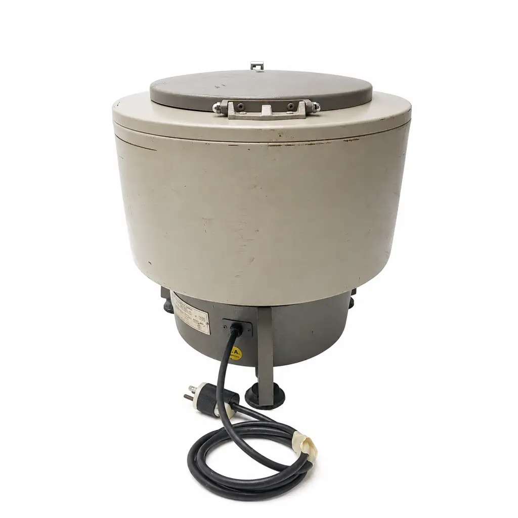 Beige biomed certified centrifuge with gray lid and black power cord by international equipment company