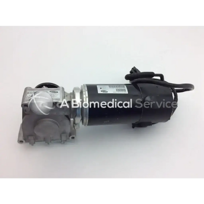 Black cylindrical medical air compressor with silver metallic housing and wiring for invacare storm torque sp storm power chair