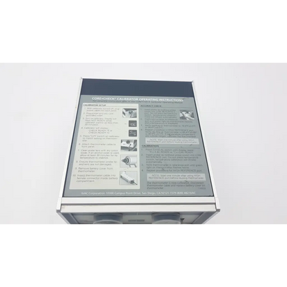Silver metallic rectangular ivac core calibrator 900 with printed operating instructions and diagrams on front panel