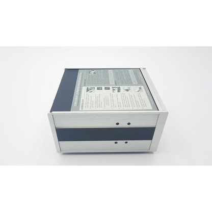Silver and dark gray metallic ivac core calibrator 900 with ribbed panels and printed instruction label on top surface