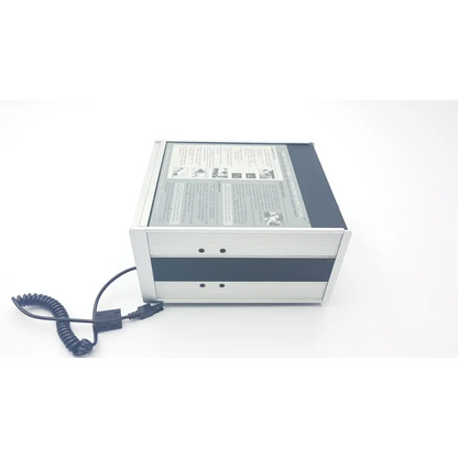 Silver and black rectangular ivac core calibrator 900 with coiled cable for precise core calibration tasks