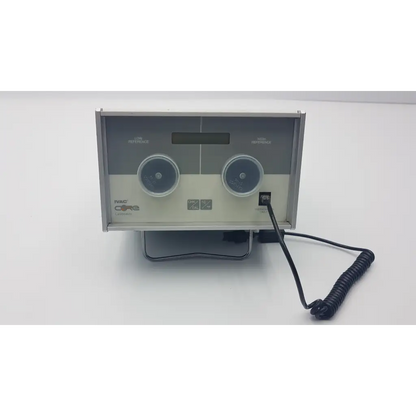 Silver and beige ivac core calibrator 900 with dual-channel, two dials, digital display, and coiled black power cord