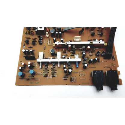 Brown circuit board with black white and blue electronic components in jalco power supply bbbdg2-7 model