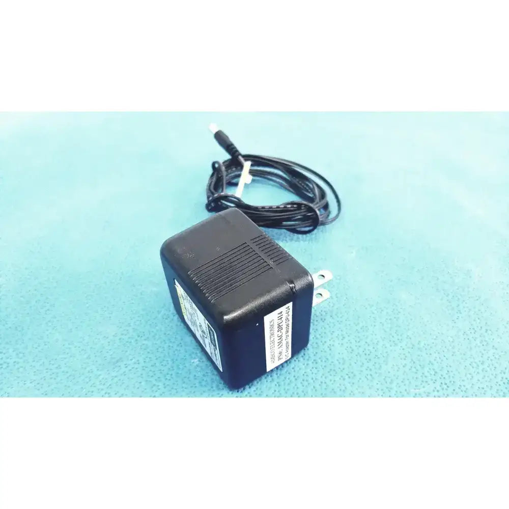 Black plastic jameco reliapro ac adapter with transformer input 120 vac model coiled power cord and two-prong plug