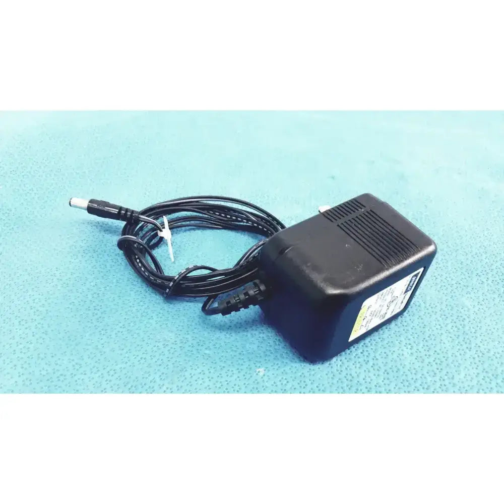 Black plastic jameco reliapro plug-in class 2 transformer input with coiled cable and white connector vac model dc060120