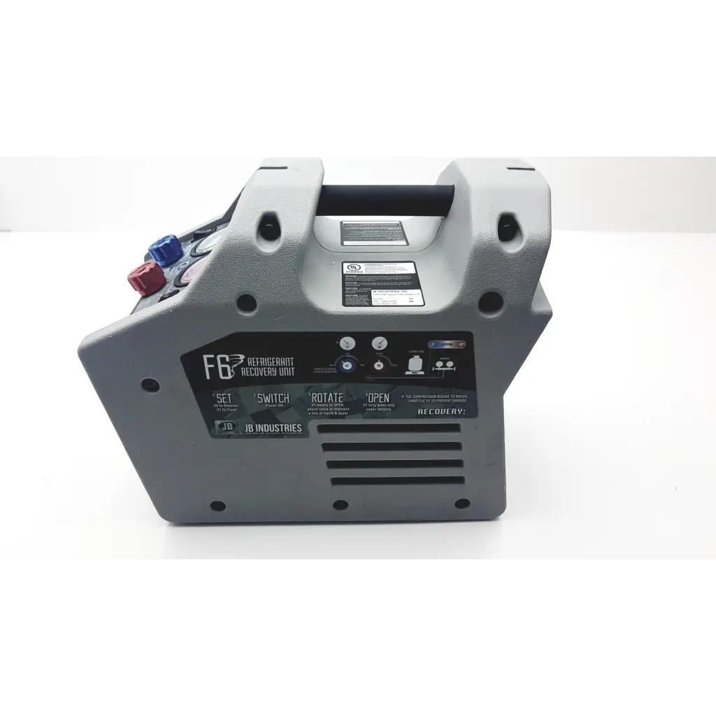 Gray plastic jb industries f6-dp piston refrigerant recovery unit with black handle and colored valves for refrigerant recovery