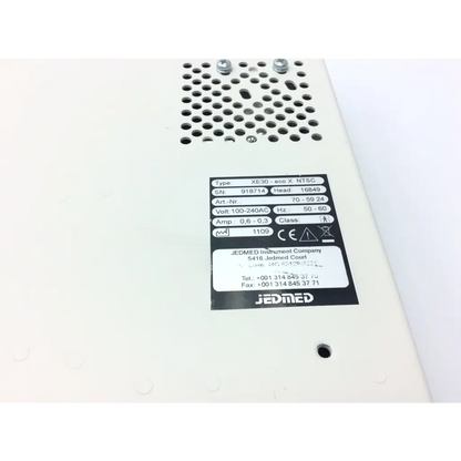 White jedmed xe30-ecox ntsc power supply unit with perforated metal casing and black label for video otoscope console
