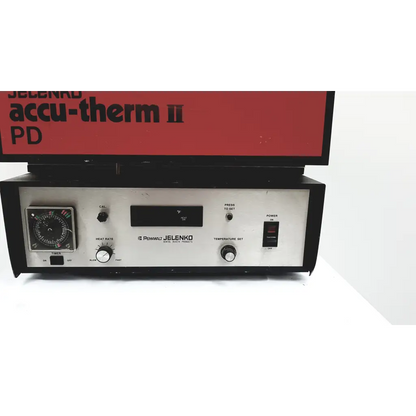 Black and silver jelenko accu-therm ii pd furnace temperature control unit with dials switches and digital display