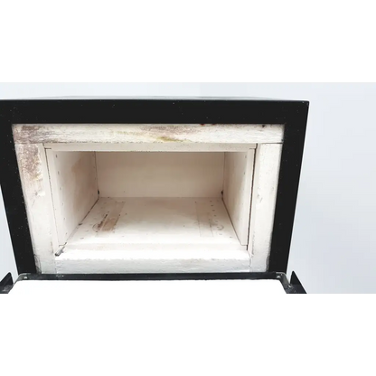 Black-framed ceramic jelenko accu-therm ii pd furnace with white interior chamber showing signs of use