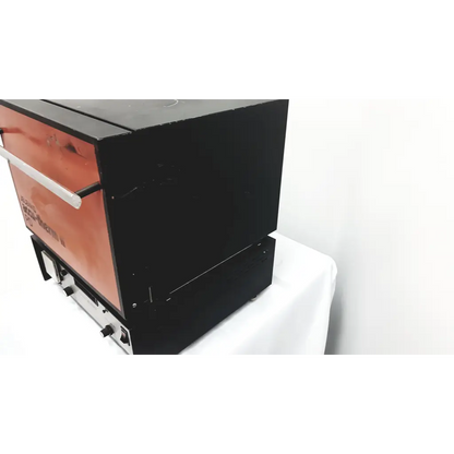Black and orange jelenko accu-therm ii pd furnace countertop oven with stainless steel handle and commercial-grade design