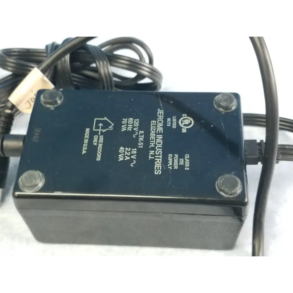 Black rectangular jerome industries iltk-51 power supply adapter with labeled specifications and coiled black cord for 120v 60hz 2.2a