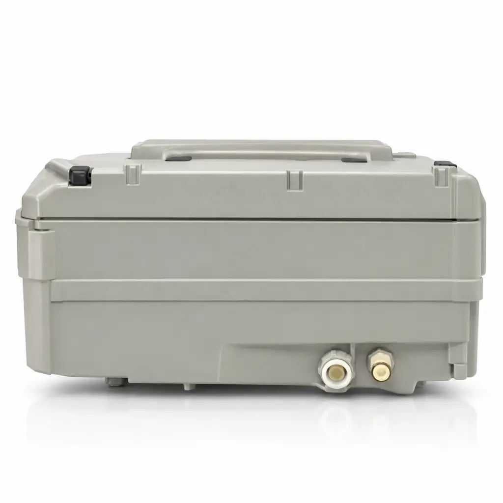 Gray plastic industrial-grade pump control unit housing with two brass threaded ports for joerns triline txcair plus