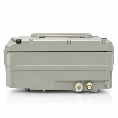 Gray plastic industrial-grade pump control unit housing with two brass threaded ports for joerns triline txcair plus