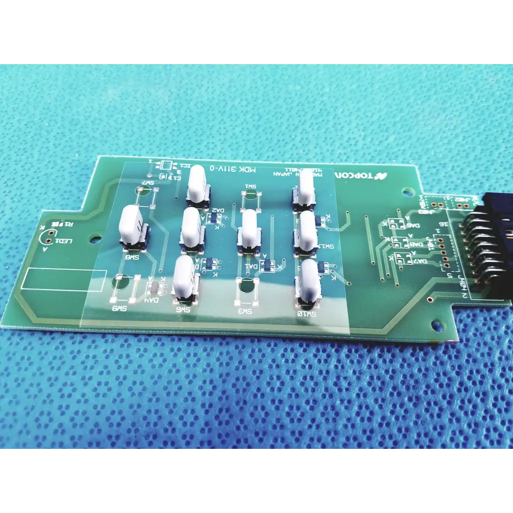 Green pcb board with white components and silver traces branded topcon for fundus retinal camera joystick model 4182074011
