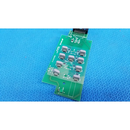 Green printed circuit board with gray components and black connector for joystick base control button matrix pcb