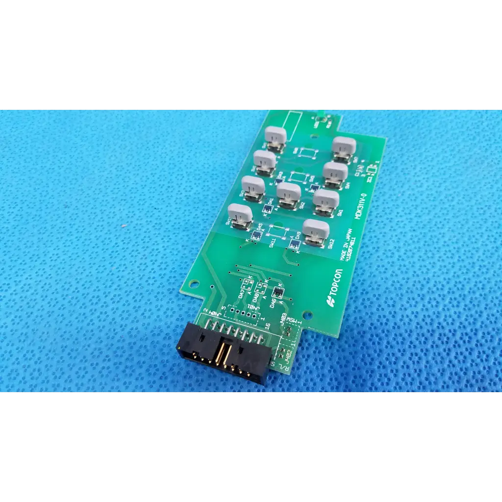 Green rectangular joystick base control pcb with ten gray switches and black connector for topcon retinal camera