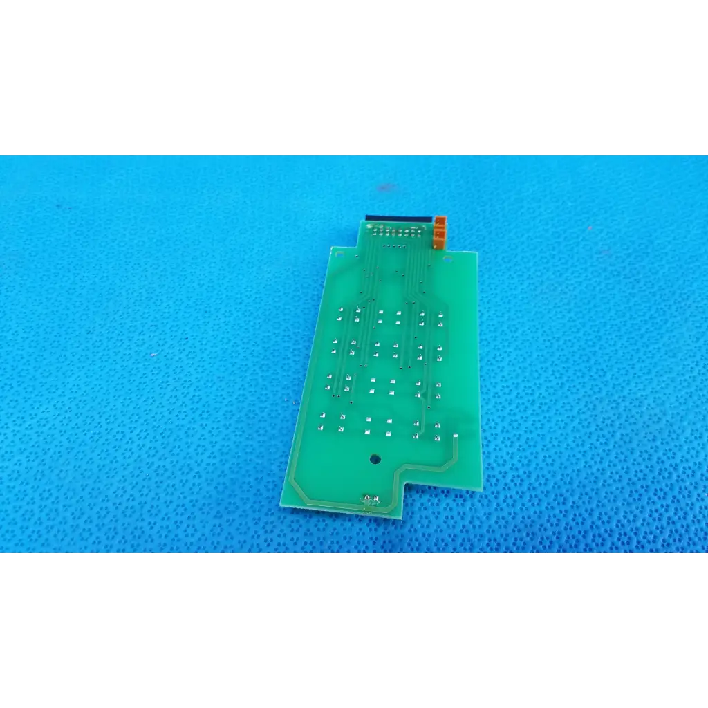 Green rectangular joystick base control button matrix pcb with silver solder points and orange connector for retinal camera