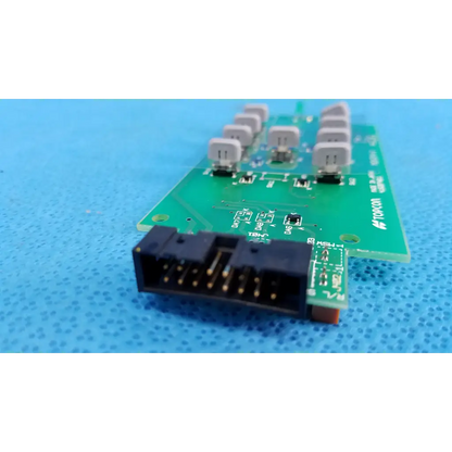 Green joystick base control button matrix pcb with black connector and gray capacitors for topcon retinal camera