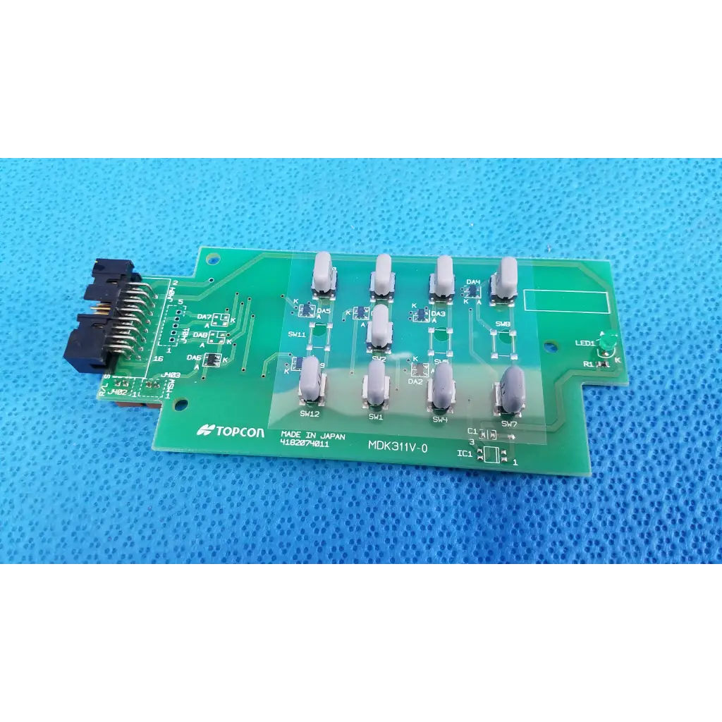 Green topcon mdk311v-0 circuit board with gray switches and black connector joystick base control for retinal camera