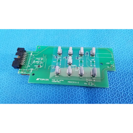 Green topcon mdk311v-0 circuit board with gray switches and black connector joystick base control for retinal camera