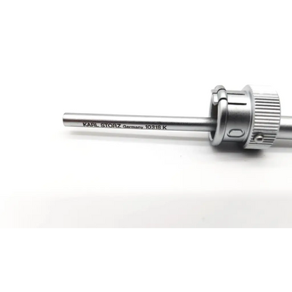 Silver metallic karl storz 10318k cannula with engraved shaft and textured knurled adjustment knob in stainless steel