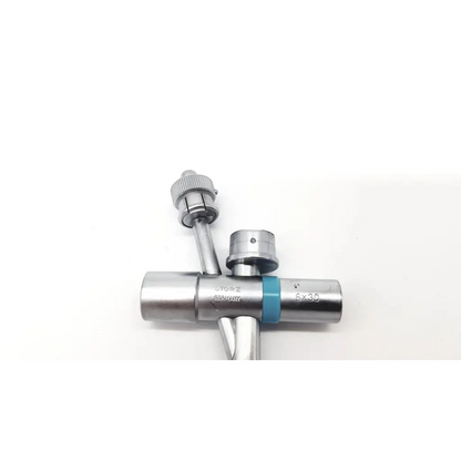 Silver metallic karl storz 10338a scope tube with blue band and engraved markings for surgical use