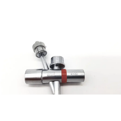 Silver metallic swiss-made t-shaped pipe fitting with red rubber band and engravings karl storz 10338c branch tube