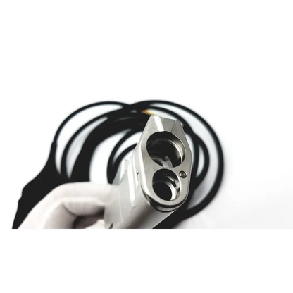 Silver metallic dual-barrel gun grip with polished finish and black coiled cable for karl storz imaging in precise medical procedures
