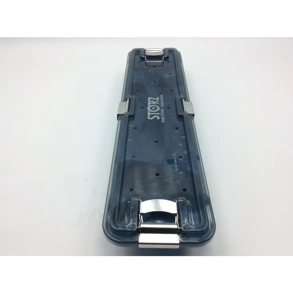 Dark translucent plastic karl storz flexible scope sterilization tray with silver metal clasps and storz logo on the side
