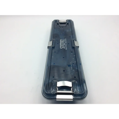 Dark translucent plastic karl storz flexible scope sterilization tray with silver metal clasps and storz logo on the side