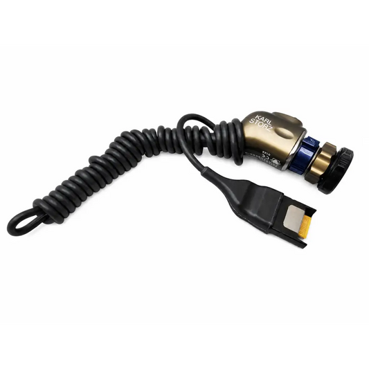 Karl storz medical equipment camera head with gold metallic housing and coiled black cable