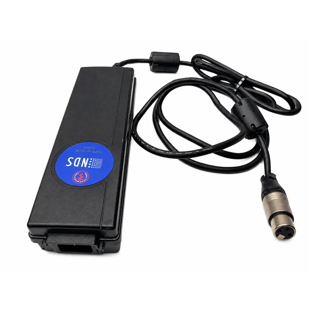 Black rectangular karl storz tc009 cable adapter with blue sdn label connected to coiled cable and silver xlr connector