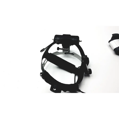 Keeler vantage plus black head-mounted surgical lamp with adjustable arms and central light for binocular indirect use