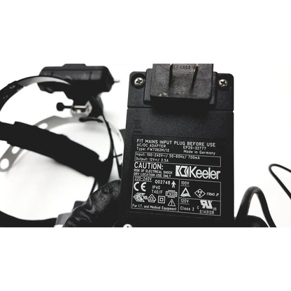 Black plastic ac dc adapter with european plug and labeled specs for keeler vantage plus binocular indirect ophthalmoscope