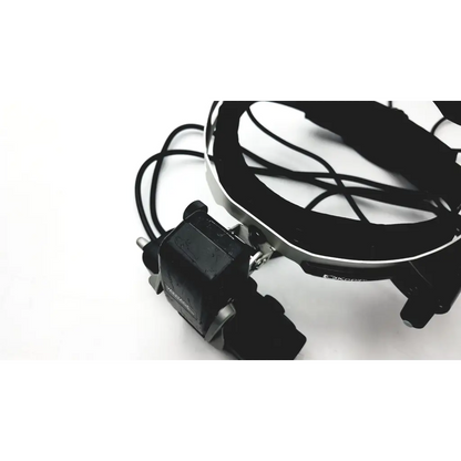 Black keeler vantage plus led bio head-mounted surgical lamp with adjustable arm and articulated joints for ophthalmoscope use